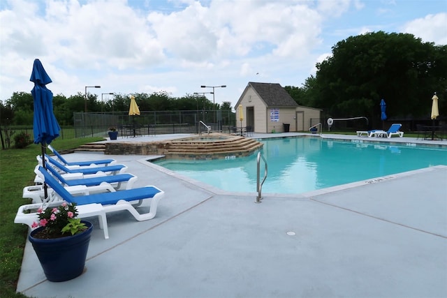 151 Summer Place Cir, Pottsboro, TX 75076 - community pool featuring a patio, a community hot tub, and an outdoor structure
