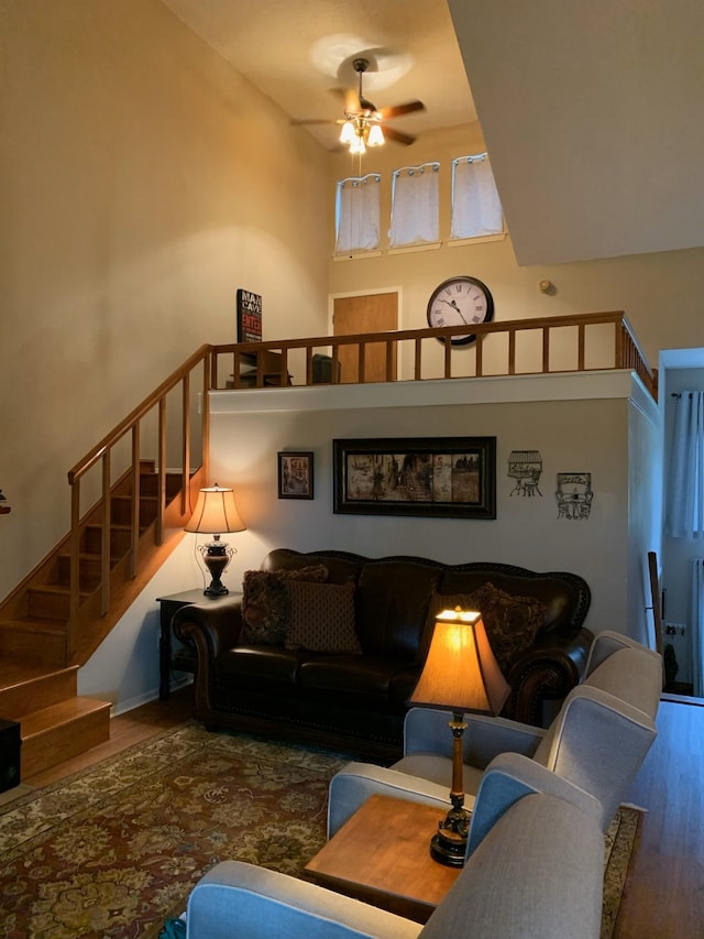 151 Summer Place Cir, Pottsboro, TX 75076 - living area with wood finished floors, a ceiling fan, stairs, and a high ceiling
