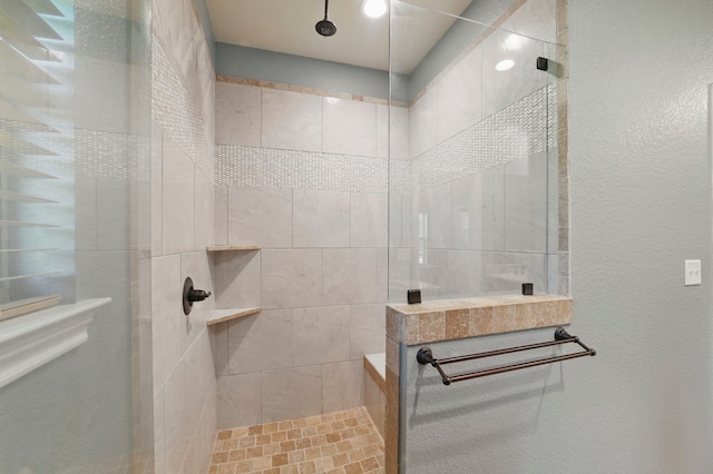 2304 Forest Hill Ln, Granbury, TX 76048 - full bathroom featuring walk in shower and a textured wall