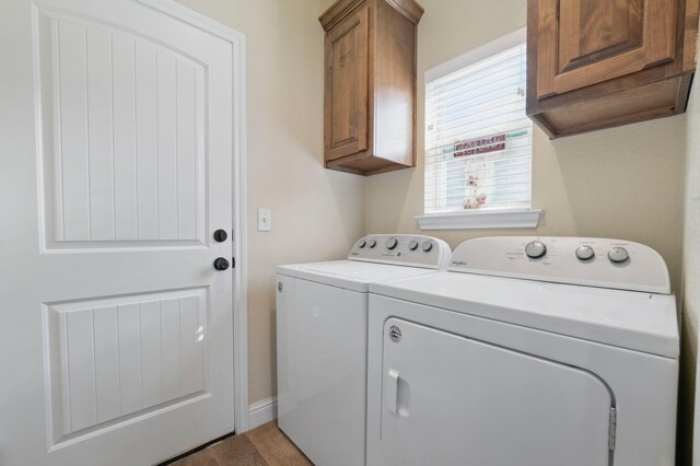2304 Forest Hill Ln, Granbury, TX 76048 - laundry room with cabinet space and separate washer and dryer