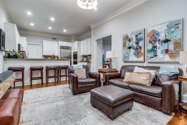3303 Blackburn St Unit 402, Dallas, TX 75204 - living area featuring light wood finished floors, crown molding, and recessed lighting