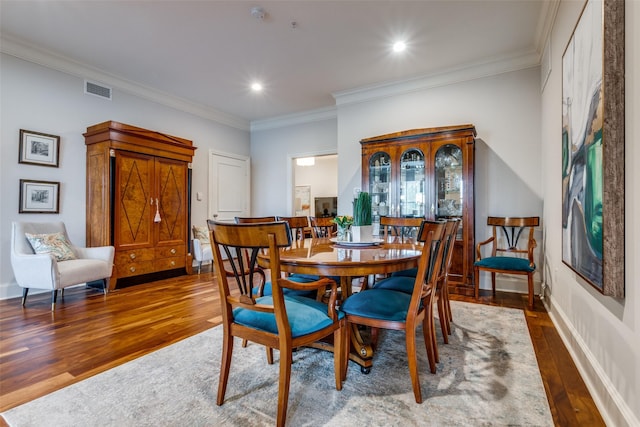 3303 Blackburn St Unit 402, Dallas, TX 75204 - dining area with hardwood / wood-style flooring, ornamental molding, recessed lighting, and baseboards