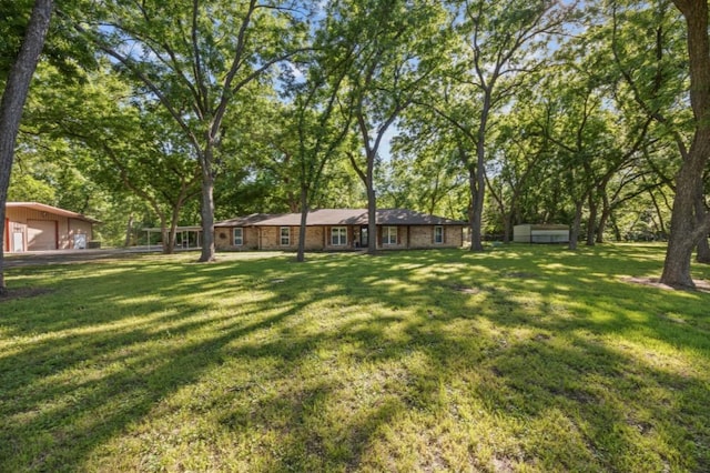 3280 Shady Grove Rd, Midlothian, TX 76065 - view of grassy yard with an outbuilding and a garage