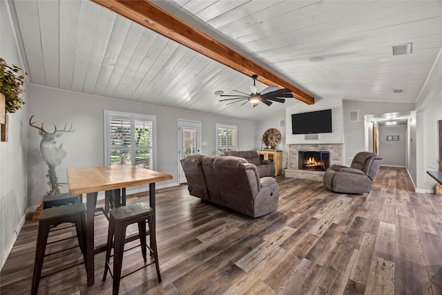 3280 Shady Grove Rd, Midlothian, TX 76065 - living area featuring dark wood-type flooring, a warm lit fireplace, a ceiling fan, baseboards, and wooden ceiling