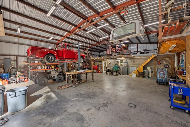 3280 Shady Grove Rd, Midlothian, TX 76065 - garage featuring a workshop area and metal wall