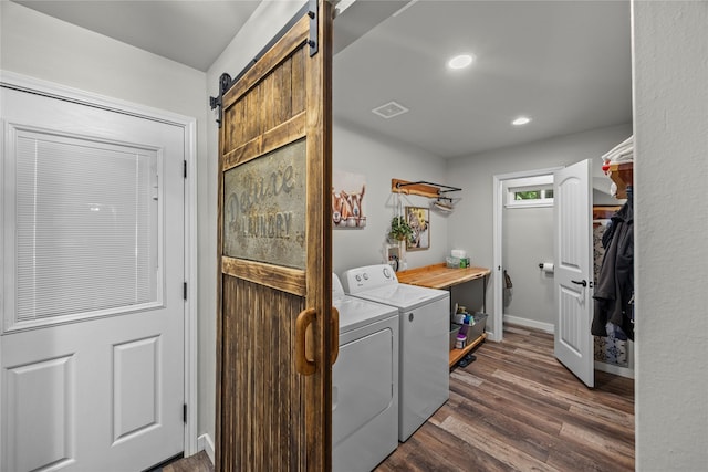 3280 Shady Grove Rd, Midlothian, TX 76065 - laundry area featuring a barn door, separate washer and dryer, dark wood-type flooring, recessed lighting, and baseboards
