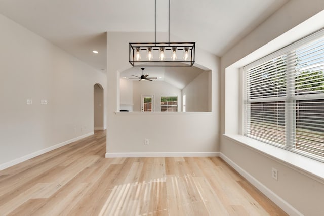 479 Sausalito Dr, Rockwall, TX 75087 - unfurnished dining area featuring a ceiling fan, plenty of natural light, arched walkways, light wood finished floors, and recessed lighting