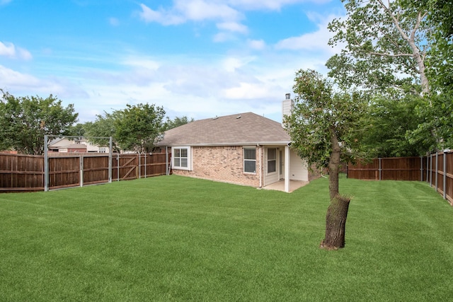 479 Sausalito Dr, Rockwall, TX 75087 - rear view of property featuring a chimney, brick siding, a shingled roof, and a patio