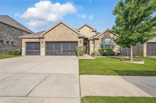 520 Shoreline Ridge Dr, Little Elm, TX 75068 - view of front of house with a garage, concrete driveway, a front yard, and brick siding