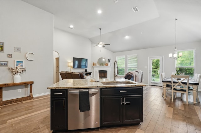 520 Shoreline Ridge Dr, Little Elm, TX 75068 - kitchen with stainless steel dishwasher, a sink, ceiling fan, light wood finished floors, and a fireplace