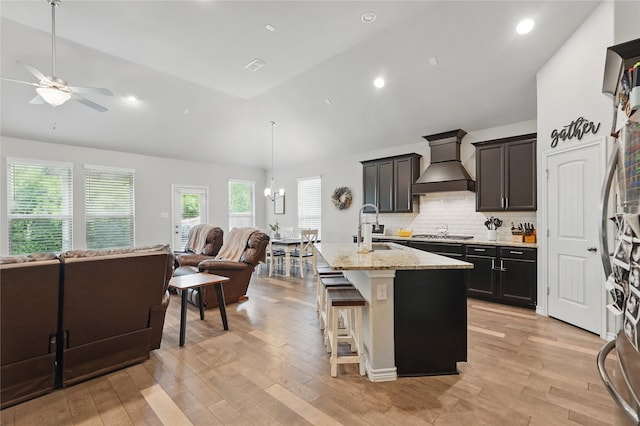 520 Shoreline Ridge Dr, Little Elm, TX 75068 - kitchen featuring custom range hood, open floor plan, a sink, ceiling fan, and high vaulted ceiling