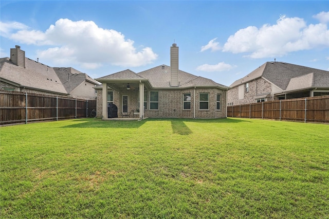 520 Shoreline Ridge Dr, Little Elm, TX 75068 - back of property featuring a ceiling fan, a chimney, a patio, and brick siding