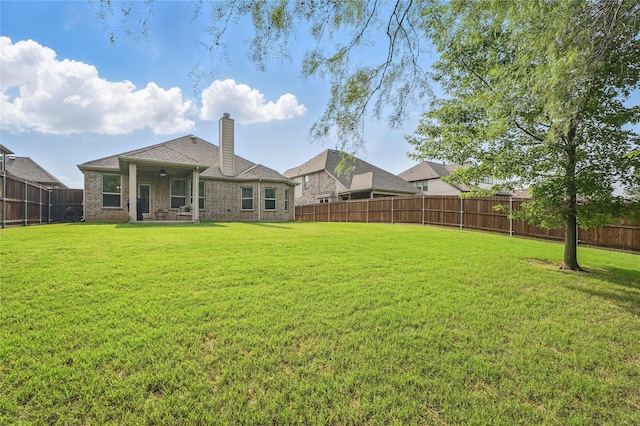 520 Shoreline Ridge Dr, Little Elm, TX 75068 - rear view of house featuring a chimney and brick siding