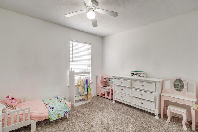 1308 Stetson Trl, Saginaw, TX 76131 - bedroom with light carpet, a textured ceiling, and a ceiling fan