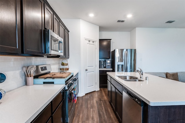 791 Evergreen St, Princeton, TX 75407 - kitchen with stainless steel appliances, a sink, dark wood-type flooring, light countertops, and backsplash