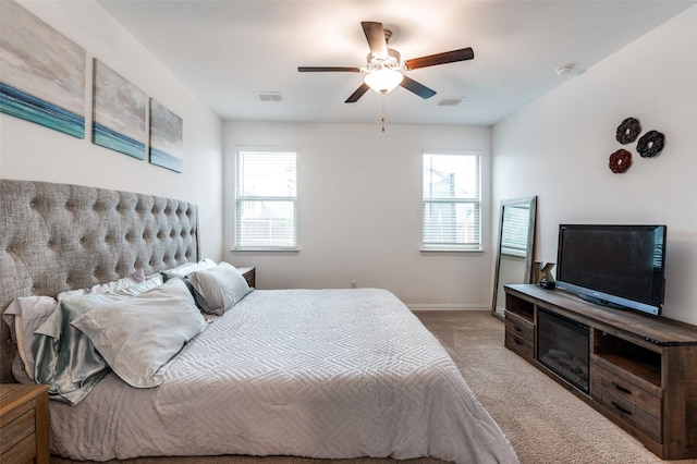 791 Evergreen St, Princeton, TX 75407 - bedroom featuring light carpet, multiple windows, baseboards, and ceiling fan