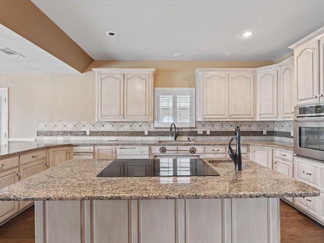 333 Forest Trl, Weatherford, TX 76085 - kitchen featuring a sink, oven, black electric cooktop, decorative backsplash, and recessed lighting
