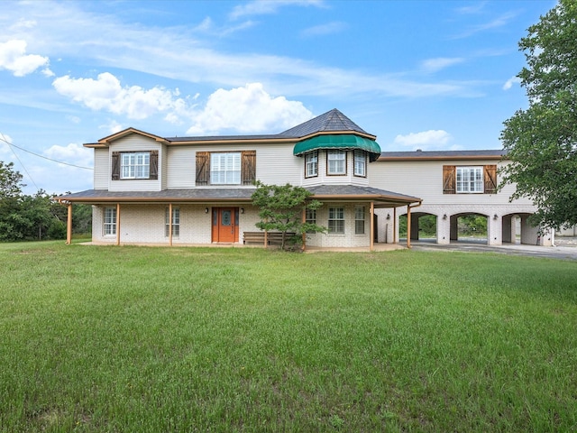 333 Forest Trl, Weatherford, TX 76085 - view of front facade with a front yard, brick siding, and a carport