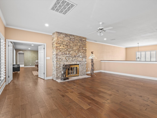 333 Forest Trl, Weatherford, TX 76085 - unfurnished living room featuring ceiling fan, crown molding, wood finished floors, a stone fireplace, and baseboards