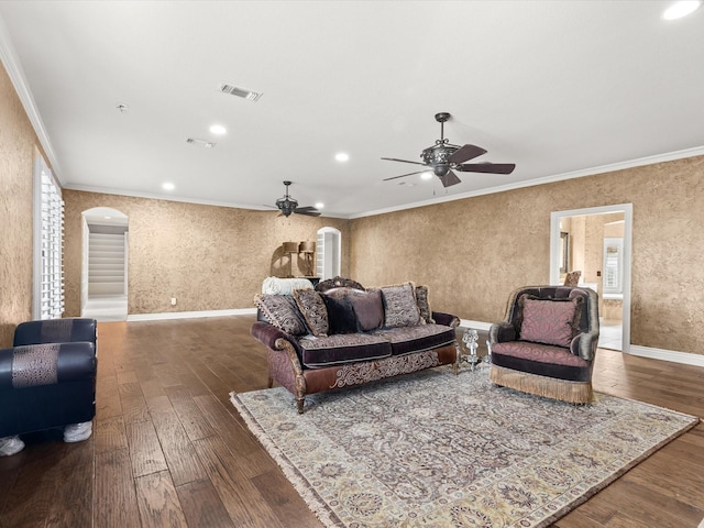 333 Forest Trl, Weatherford, TX 76085 - living area featuring a ceiling fan, arched walkways, hardwood / wood-style flooring, ornamental molding, and plenty of natural light