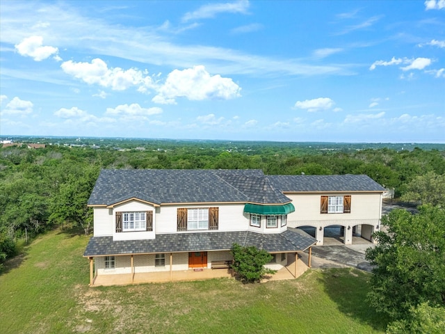 333 Forest Trl, Weatherford, TX 76085 - view of front of property featuring concrete driveway, a forest view, and a front yard