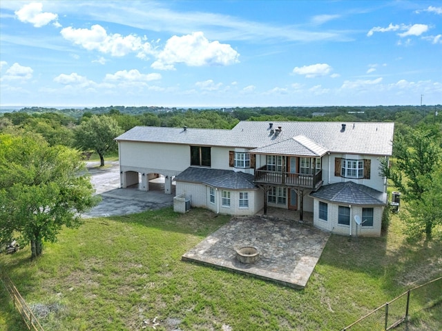 333 Forest Trl, Weatherford, TX 76085 - rear view of property with a balcony, a fire pit, a patio area, and concrete driveway