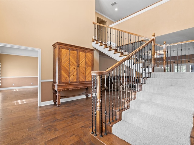 333 Forest Trl, Weatherford, TX 76085 - stairs with wood finished floors, a towering ceiling, ornamental molding, and baseboards