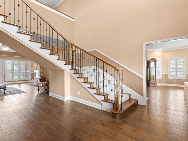 333 Forest Trl, Weatherford, TX 76085 - stairs with a high ceiling, wood finished floors, baseboards, and crown molding