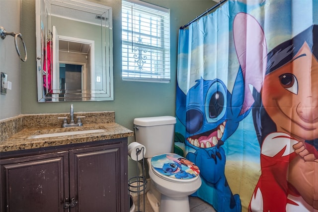 7419 Concordia Ln, Dallas, TX 75241 - bathroom with vanity, toilet, and curtained shower