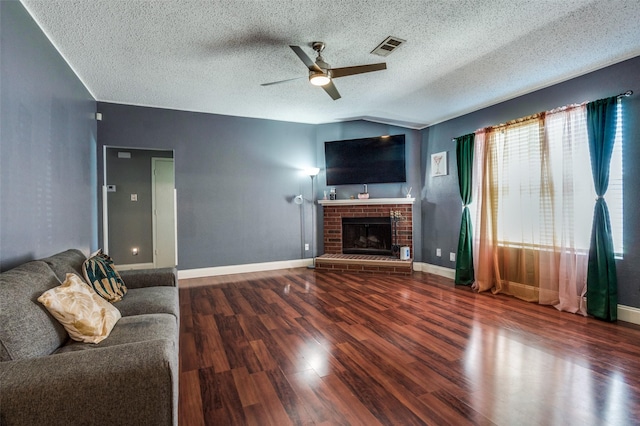 7419 Concordia Ln, Dallas, TX 75241 - unfurnished living room with ceiling fan, wood finished floors, a fireplace, vaulted ceiling, and baseboards