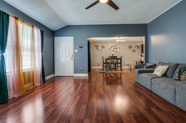 7419 Concordia Ln, Dallas, TX 75241 - living room with a ceiling fan, vaulted ceiling, wood finished floors, and a textured ceiling
