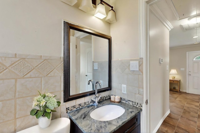 102 Mitscher Dr, Dallas, TX 75224 - bathroom with tile walls, ornamental molding, and vanity