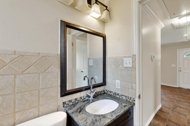 102 Mitscher Dr, Dallas, TX 75224 - bathroom featuring ornamental molding, tile walls, toilet, and vanity