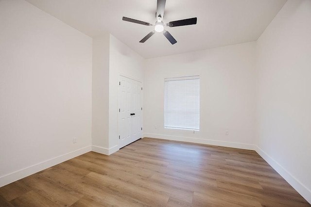 1410 Lee Ave, Fort Worth, TX 76164 - unfurnished room with ceiling fan, wood finished floors, and baseboards
