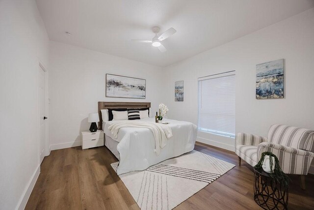 1410 Lee Ave, Fort Worth, TX 76164 - bedroom with wood finished floors, baseboards, and a ceiling fan