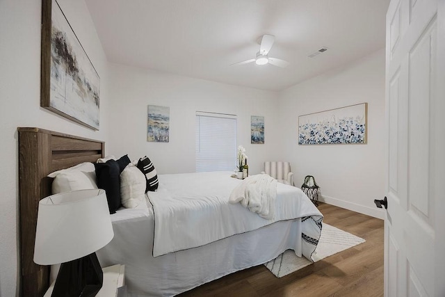 1410 Lee Ave, Fort Worth, TX 76164 - bedroom with wood finished floors, a ceiling fan, and baseboards