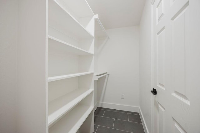 1410 Lee Ave, Fort Worth, TX 76164 - spacious closet with dark tile patterned flooring