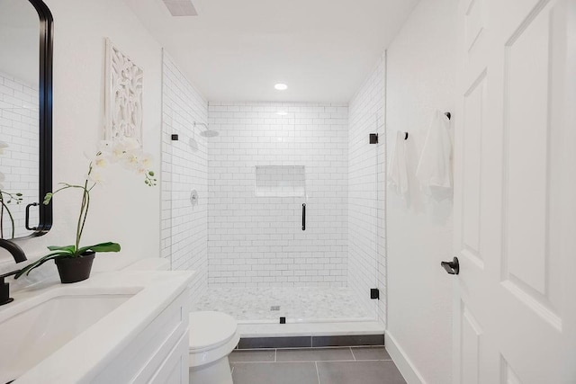 1410 Lee Ave, Fort Worth, TX 76164 - bathroom featuring tile patterned floors, a stall shower, toilet, vanity, and recessed lighting