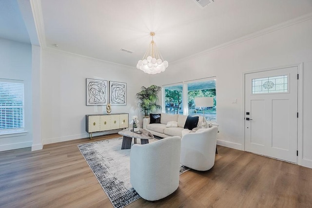 1410 Lee Ave, Fort Worth, TX 76164 - living room featuring light wood-style floors, ornamental molding, a chandelier, and baseboards
