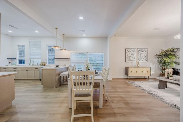 1410 Lee Ave, Fort Worth, TX 76164 - dining space with light wood-style flooring, recessed lighting, baseboards, and ornamental molding