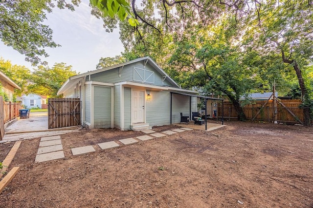1410 Lee Ave, Fort Worth, TX 76164 - rear view of house with a fenced backyard and entry steps