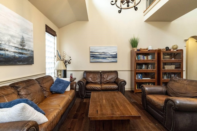 2324 Stone Creek Dr, Mckinney, TX 75072 - living room featuring wood finished floors, a baseboard radiator, lofted ceiling, and arched walkways