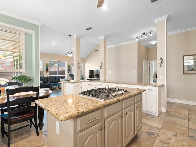2448 Sky Harbor Dr, Plano, TX 75025 - kitchen with open floor plan, stainless steel gas cooktop, ceiling fan, a center island, and lofted ceiling