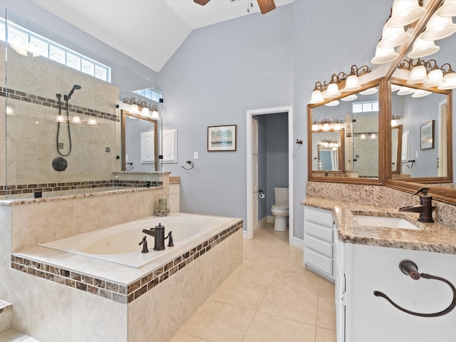 2448 Sky Harbor Dr, Plano, TX 75025 - full bathroom with tile patterned floors, lofted ceiling, a garden tub, a ceiling fan, and toilet