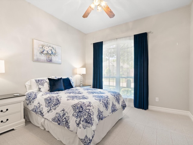 2448 Sky Harbor Dr, Plano, TX 75025 - bedroom featuring light carpet, multiple windows, baseboards, and a ceiling fan