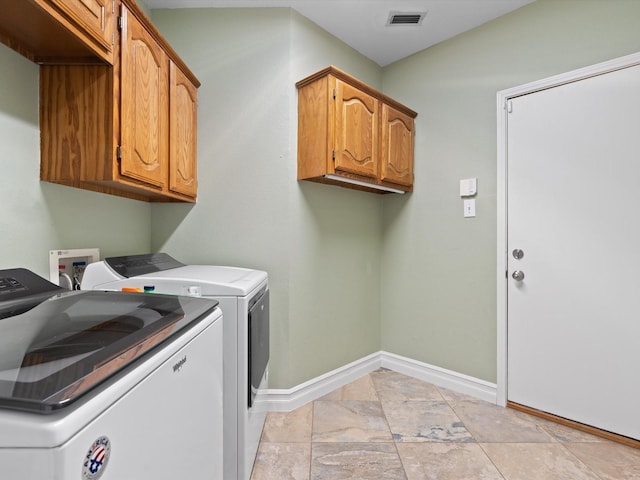 2448 Sky Harbor Dr, Plano, TX 75025 - laundry area with cabinet space, independent washer and dryer, and baseboards