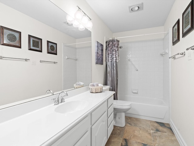 2448 Sky Harbor Dr, Plano, TX 75025 - bathroom featuring vanity, toilet, shower / bath combo, stone finish floors, and baseboards