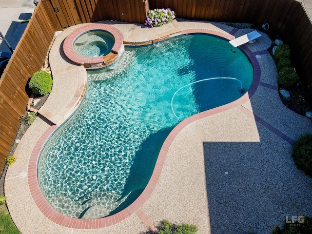 2448 Sky Harbor Dr, Plano, TX 75025 - view of pool with a diving board and a pool with connected hot tub