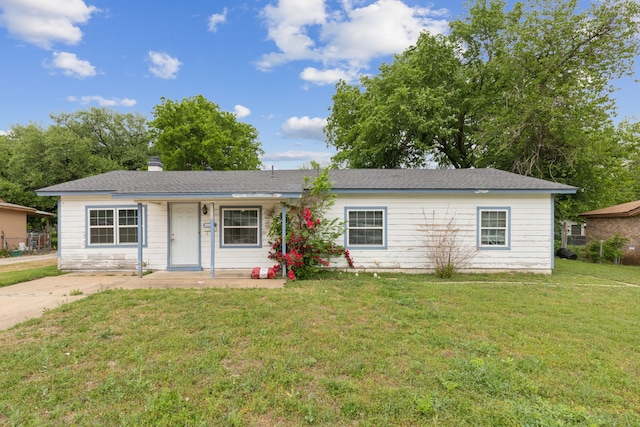 5225 Ira St N, Haltom City, TX 76117 - ranch-style home featuring a front lawn and a chimney