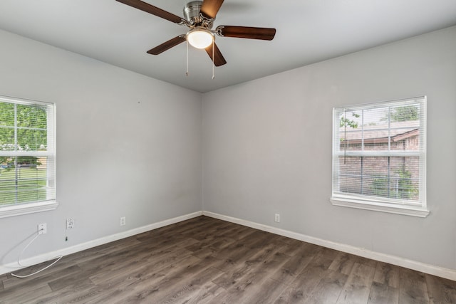 5225 Ira St N, Haltom City, TX 76117 - spare room with baseboards, dark wood-style floors, and ceiling fan